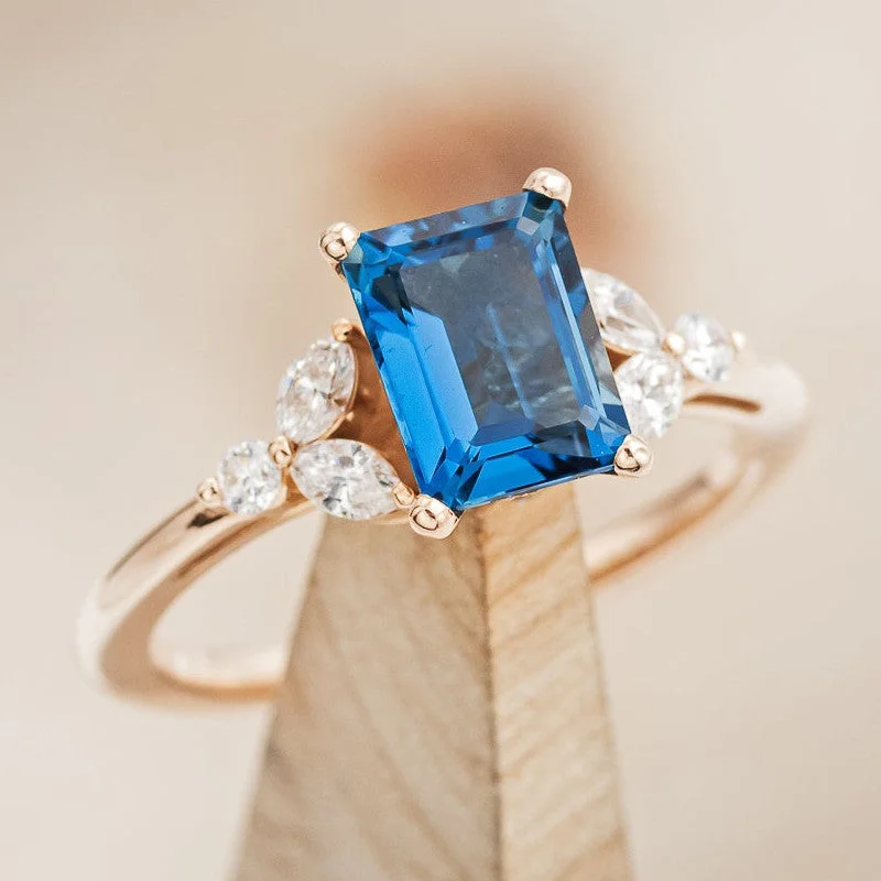 Men's Black Onyx Engagement Rings Set in Titanium for a Modern and Bold Look"BLOSSOM" - EMERALD CUT BLUE TOPAZ ENGAGEMENT RING WITH DIAMOND ACCENTS Men's Black Onyx Engagement Rings Set in Titanium for a Modern and Bold Look"BLOSSOM" - EMERALD CUT BLUE TOPAZ ENGAGEMENT RING WITH DIAMOND ACCENTS