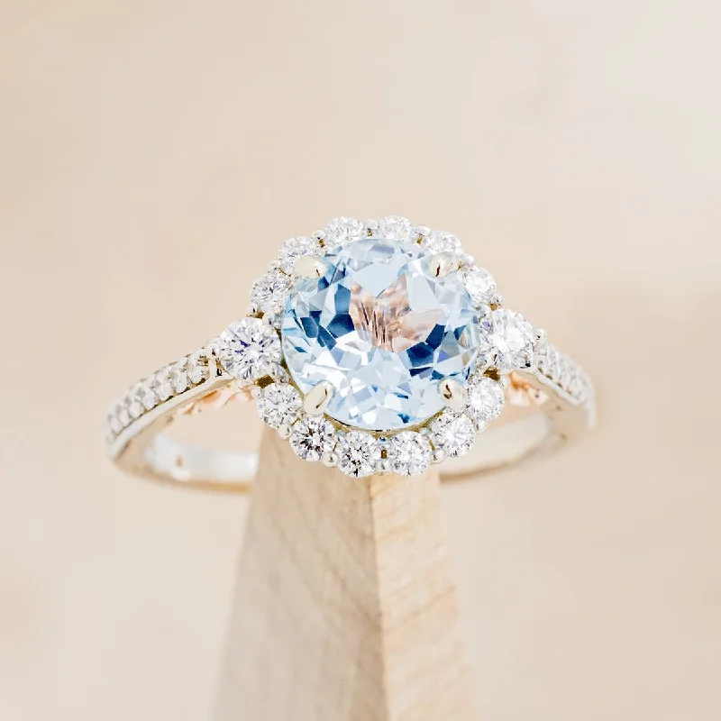 Men's Aquamarine Engagement Rings in 9K Gold with a Bezel - Set Stone"OPHELIA" - ROUND CUT SKY BLUE TOPAZ ENGAGEMENT RING WITH DIAMOND HALO & ACCENTS Men's Aquamarine Engagement Rings in 9K Gold with a Bezel - Set Stone"OPHELIA" - ROUND CUT SKY BLUE TOPAZ ENGAGEMENT RING WITH DIAMOND HALO & ACCENTS