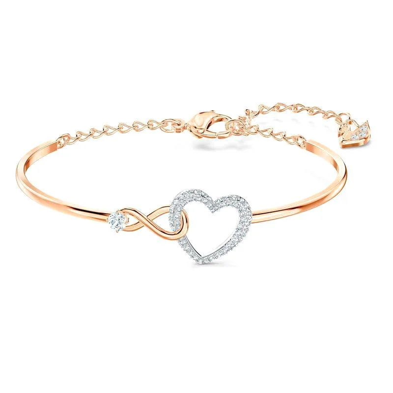 Flexible Silicone Bangles with Glow - in - the - Dark Features Swarovski Infinity Heart Crystal Rose Gold Plated Bangle Flexible Silicone Bangles with Glow - in - the - Dark Features Swarovski Infinity Heart Crystal Rose Gold Plated Bangle