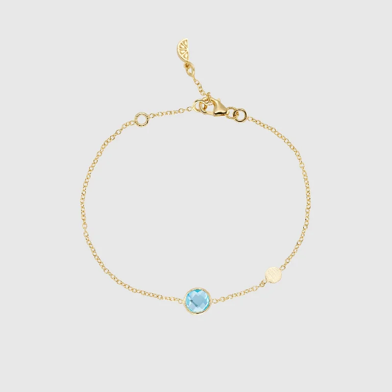 Enamel - Coated Bangles in Vibrant Rainbow Colors for a Playful StyleSalina Blue Topaz and Gold Disc Bracelet Enamel - Coated Bangles in Vibrant Rainbow Colors for a Playful StyleSalina Blue Topaz and Gold Disc Bracelet