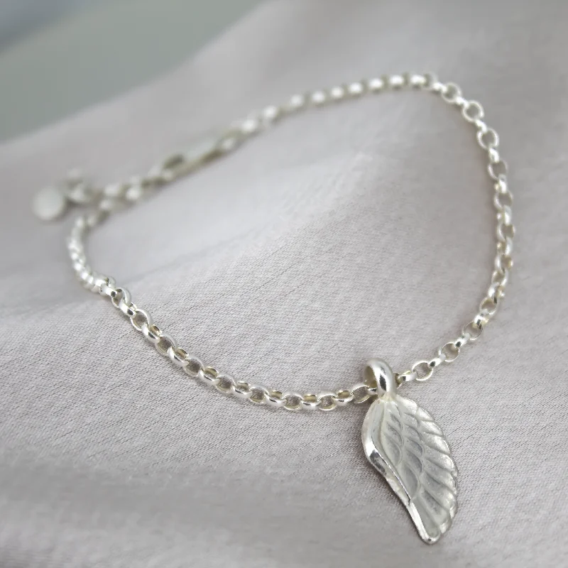 Leather - Wrapped Bangles with Studded Details for a Rock - Chic VibeAngel Wing Chain Bracelet Leather - Wrapped Bangles with Studded Details for a Rock - Chic VibeAngel Wing Chain Bracelet