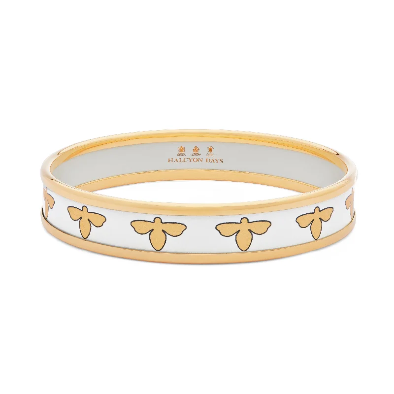 Men's Stainless Steel Bangle with Carbon Fiber Inlays for a Modern EdgeBee Cream & Gold Enamel Bangle Men's Stainless Steel Bangle with Carbon Fiber Inlays for a Modern EdgeBee Cream & Gold Enamel Bangle