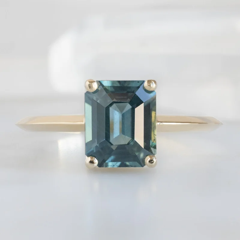 Emerald Cut Engagement Rings with Platinum Gallery and Split Shank DesignThe Bryn Ring | 1.78ct Emerald Cut Sapphire in 14K Yellow Gold Emerald Cut Engagement Rings with Platinum Gallery and Split Shank DesignThe Bryn Ring | 1.78ct Emerald Cut Sapphire in 14K Yellow Gold